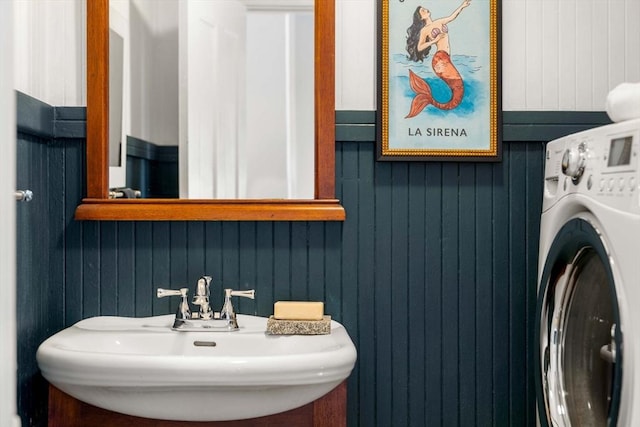 bathroom with a sink and washer / clothes dryer