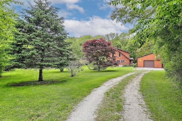 1175 Main Rd, Westport, MA 02790 - view of front facade with driveway, an outdoor structure, a front yard, and a garage