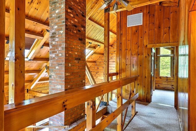 1175 Main Rd, Westport, MA 02790 - hallway featuring carpet, an upstairs landing, wooden ceiling with exposed beams, and wood walls