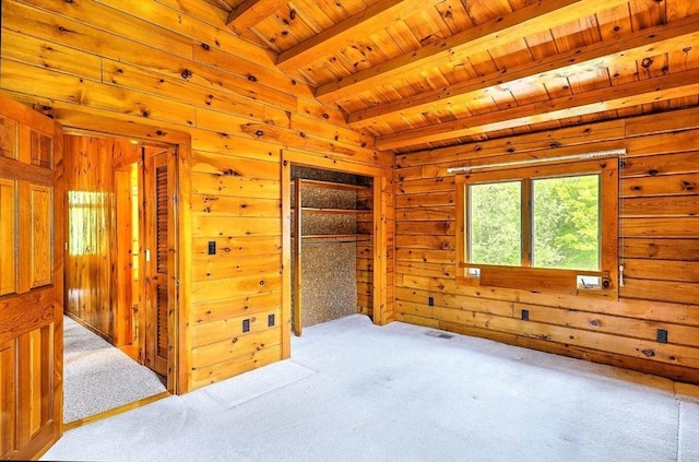 1175 Main Rd, Westport, MA 02790 - unfurnished bedroom featuring wooden ceiling with exposed beams, carpet floors, and wooden walls