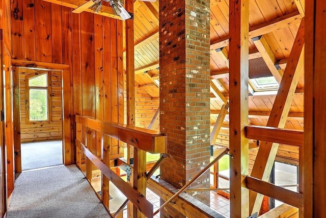 1175 Main Rd, Westport, MA 02790 - stairs featuring wood walls, carpet flooring, wooden ceiling, and a ceiling fan