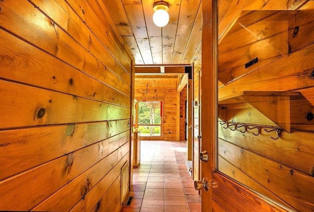 1175 Main Rd, Westport, MA 02790 - corridor with wooden walls and tile patterned flooring