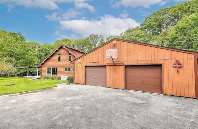 1175 Main Rd, Westport, MA 02790 - view of front of house featuring an outbuilding, a front yard, and log siding