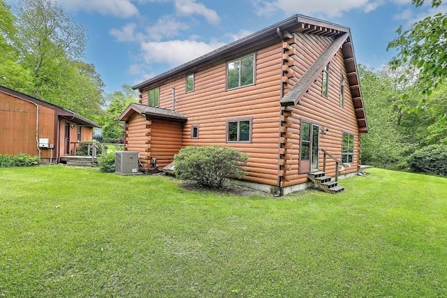 1175 Main Rd, Westport, MA 02790 - rear view of house featuring log exterior and a lawn