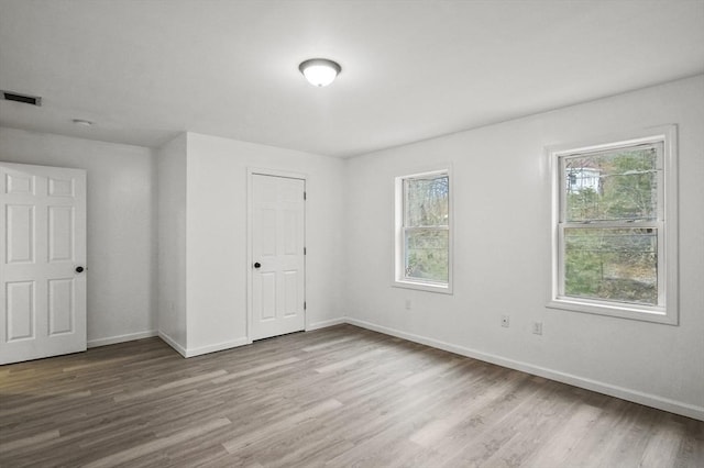 unfurnished bedroom featuring light wood-type flooring