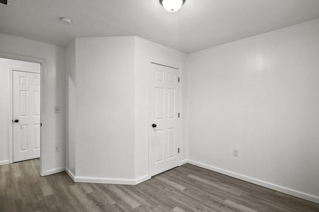 empty room with hardwood / wood-style floors