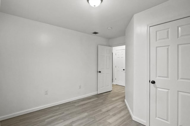 unfurnished bedroom with light hardwood / wood-style floors