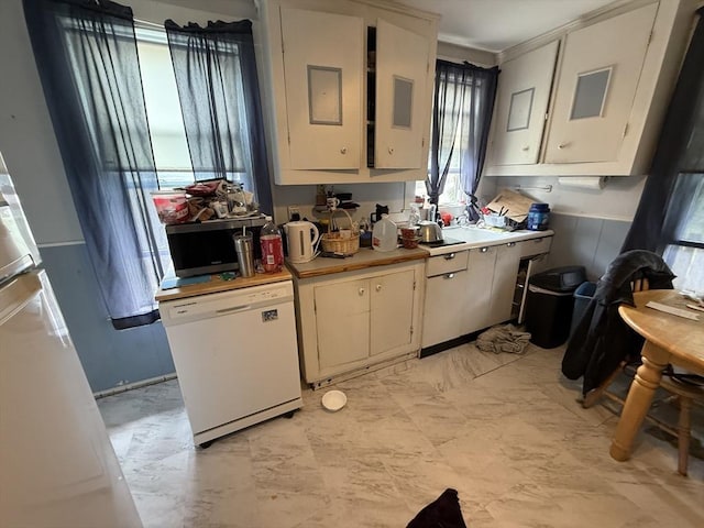 156 Euclid Ave, Lynn, MA 01904 - kitchen with dishwasher, light countertops, white cabinetry, and refrigerator