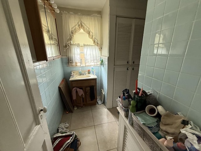 156 Euclid Ave, Lynn, MA 01904 - bathroom featuring tile walls, tile patterned flooring, vanity, and a closet