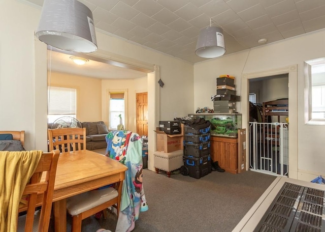 dining space featuring carpet