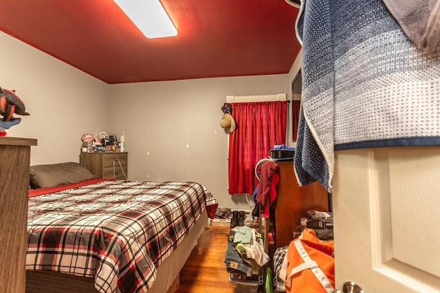 bedroom with hardwood / wood-style floors