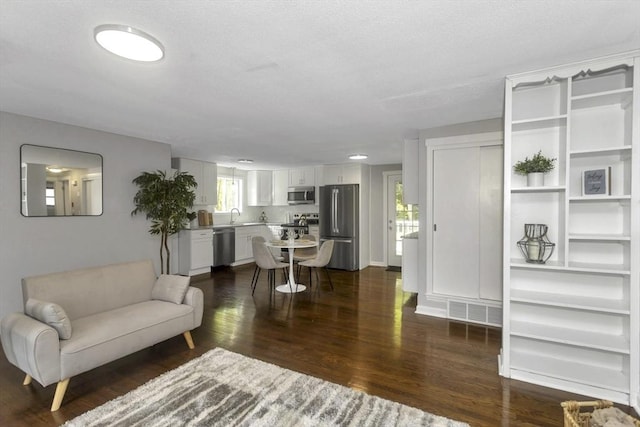 living area featuring dark wood-style floors