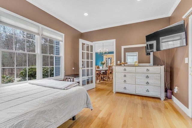 bedroom featuring crown molding, recessed lighting, baseboards, a chandelier, and light wood-style flooring