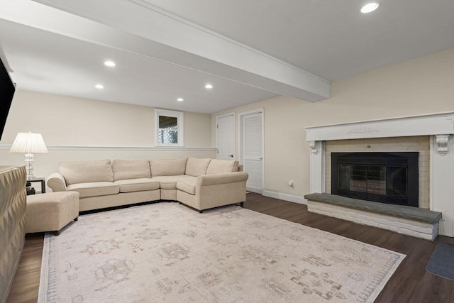 40 Brewster Rd, Cohasset, MA 02025 - living area featuring wood finished floors, recessed lighting, a glass covered fireplace, baseboards, and beam ceiling