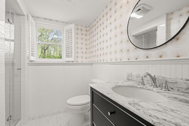 40 Brewster Rd, Cohasset, MA 02025 - full bath with a wainscoted wall, marble finish flooring, wallpapered walls, toilet, and a shower