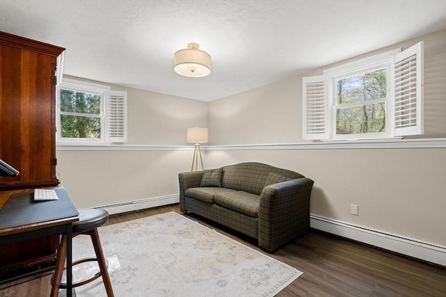 40 Brewster Rd, Cohasset, MA 02025 - living area with baseboard heating, wood finished floors, and baseboards