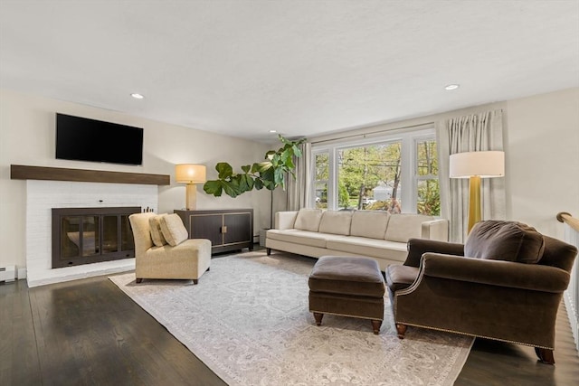 40 Brewster Rd, Cohasset, MA 02025 - living area with wood finished floors, recessed lighting, a fireplace, and baseboard heating