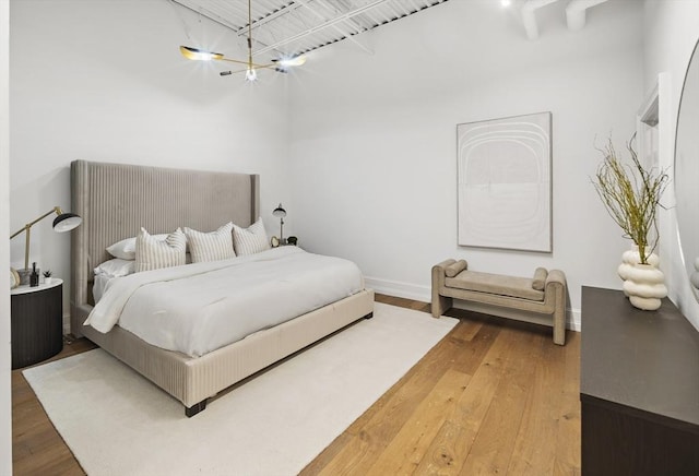 bedroom with wood-type flooring