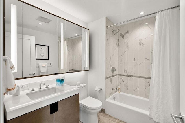 full bathroom with tile patterned floors, toilet, vanity, and shower / bath combo