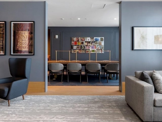 bar with wood-type flooring