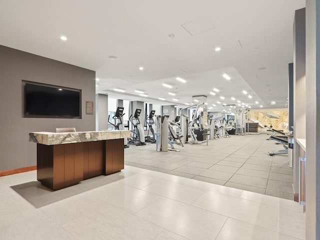 exercise room featuring light tile patterned floors