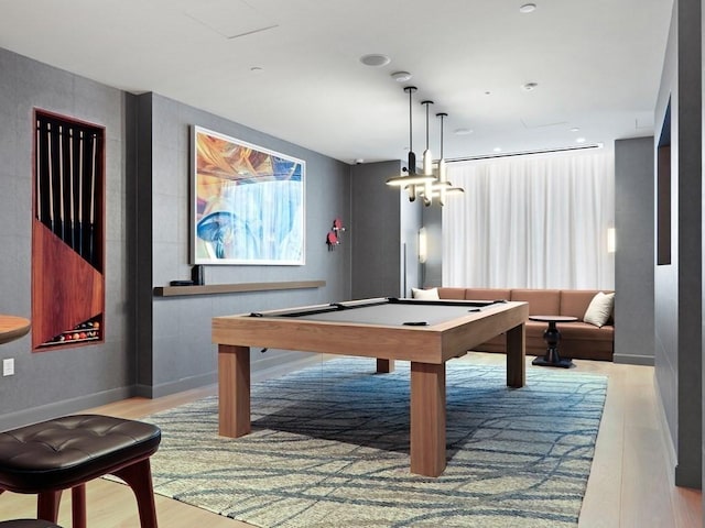 recreation room with light hardwood / wood-style flooring and pool table