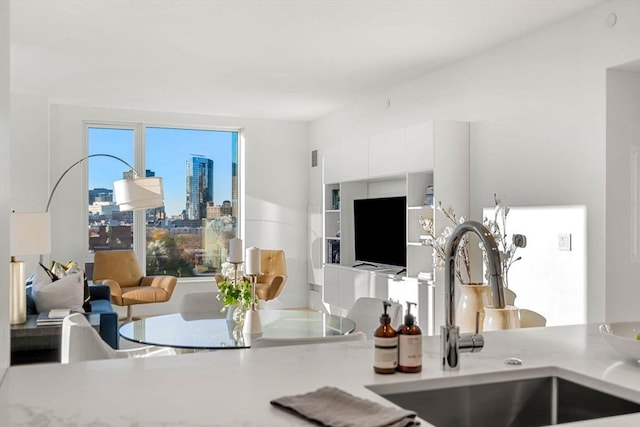 living room featuring sink and plenty of natural light