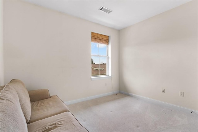 living area with light carpet