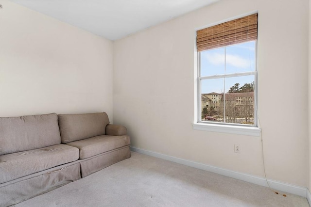 unfurnished room with light colored carpet