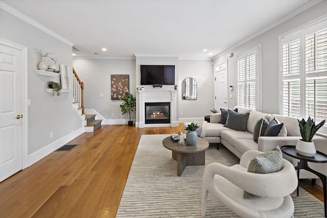 4 Lincoln Pl Unit 4, Boston, MA 02129 - living room with recessed lighting, light wood finished floors, baseboards, crown molding, and stairway