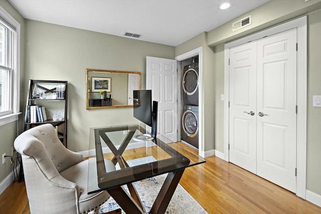 4 Lincoln Pl Unit 4, Boston, MA 02129 - office with stacked washer / drying machine, light wood finished floors, baseboards, plenty of natural light, and recessed lighting