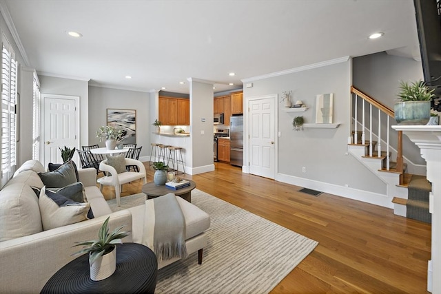 4 Lincoln Pl Unit 4, Boston, MA 02129 - living area with crown molding, recessed lighting, stairway, light wood-style floors, and baseboards