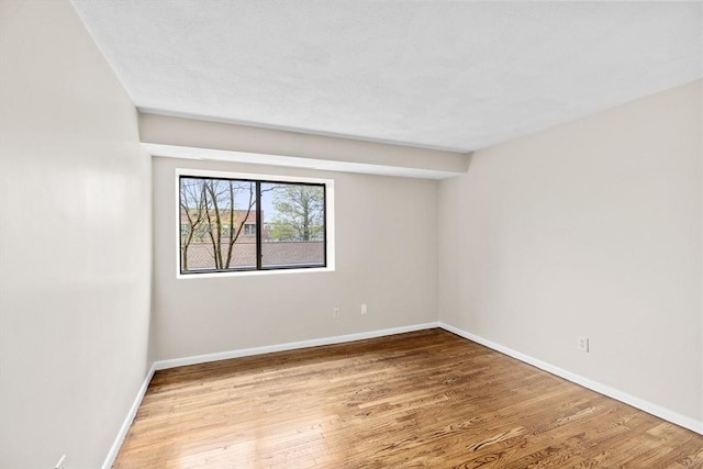 41 Centre Unit 208, Brookline, MA 02446 - empty room with baseboards and wood finished floors