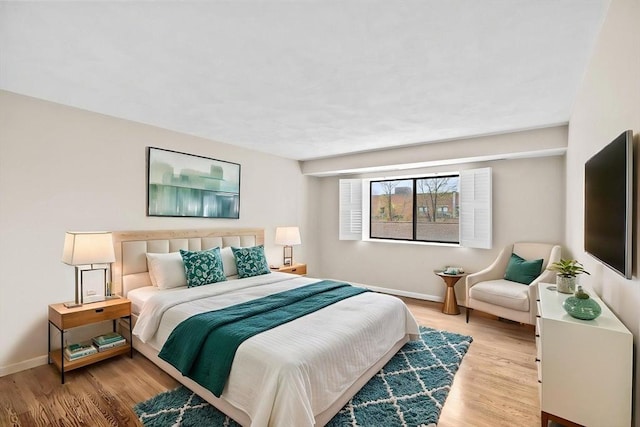 41 Centre Unit 208, Brookline, MA 02446 - bedroom with baseboards and wood finished floors