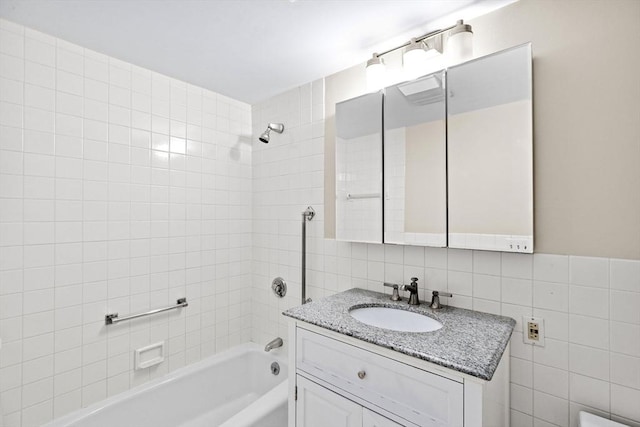 41 Centre Unit 208, Brookline, MA 02446 - full bath featuring bathtub / shower combination, tile walls, vanity, and backsplash