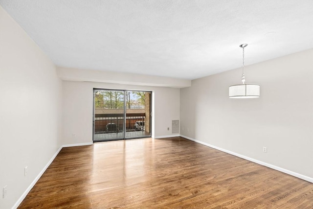 41 Centre Unit 208, Brookline, MA 02446 - empty room featuring wood finished floors and baseboards