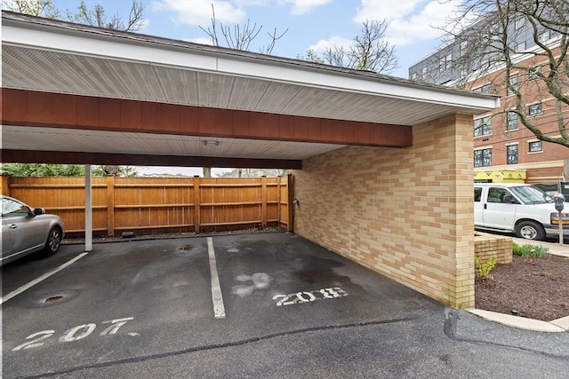 41 Centre Unit 208, Brookline, MA 02446 - covered parking lot featuring fence