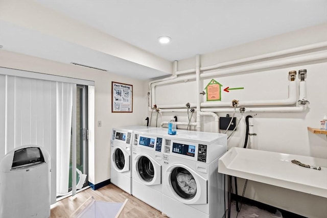 41 Centre Unit 208, Brookline, MA 02446 - shared laundry with independent washer and dryer and light wood-style flooring