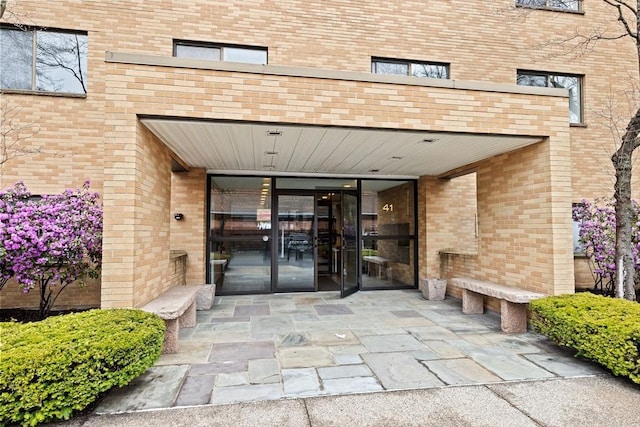 41 Centre Unit 208, Brookline, MA 02446 - doorway to property featuring brick siding