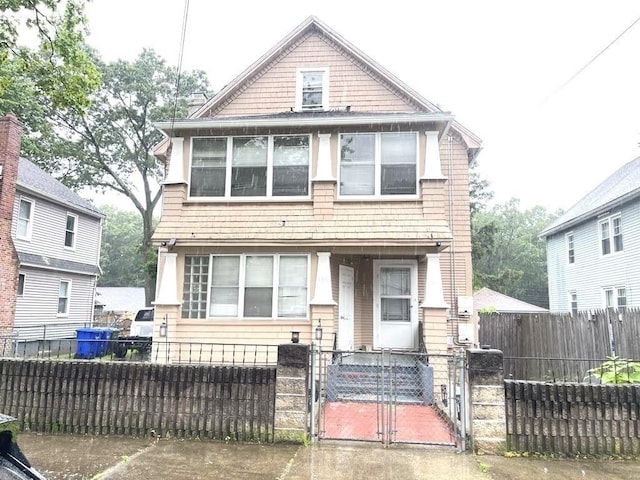 98-100 Fenwick St, Springfield, MA 01109 - view of front of house featuring a gate and a fenced front yard
