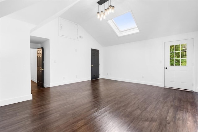 21 Beechwood Ave, Pembroke, MA 02359 - unfurnished living room with vaulted ceiling, a skylight, and dark wood finished floors