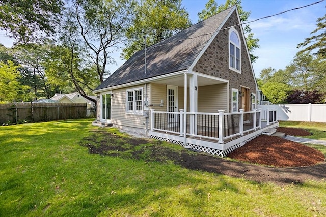 21 Beechwood Ave, Pembroke, MA 02359 - view of front of home featuring a fenced backyard, a deck, and a shingled roof