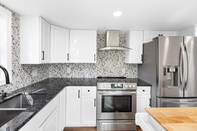 21 Beechwood Ave, Pembroke, MA 02359 - kitchen with stainless steel appliances, wall chimney exhaust hood, decorative backsplash, white cabinetry, and recessed lighting