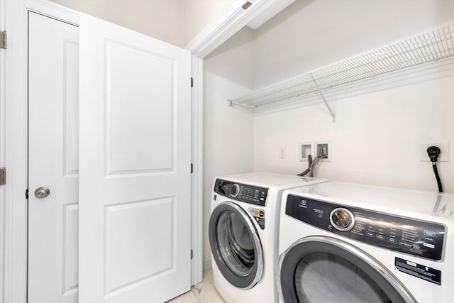 laundry room featuring laundry area and washing machine and clothes dryer