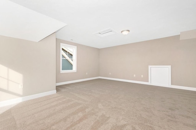 bonus room featuring baseboards and carpet