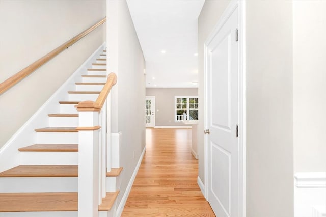 stairs featuring recessed lighting, baseboards, and wood finished floors