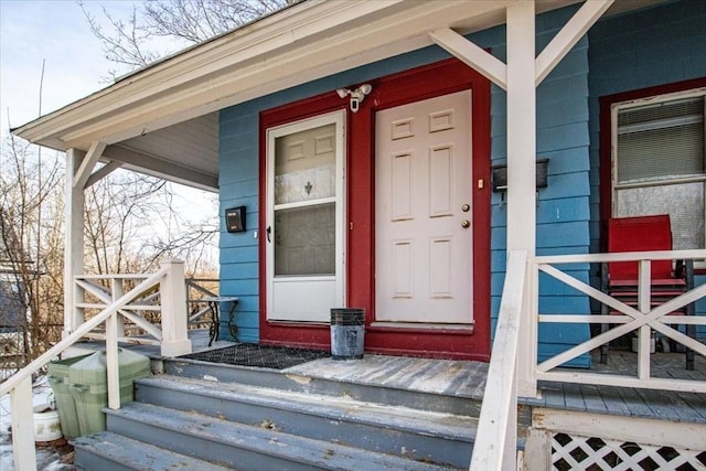 entrance to property featuring a porch