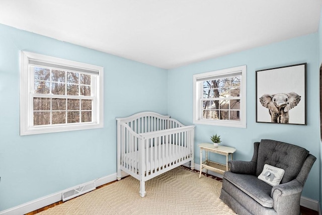 bedroom featuring a crib