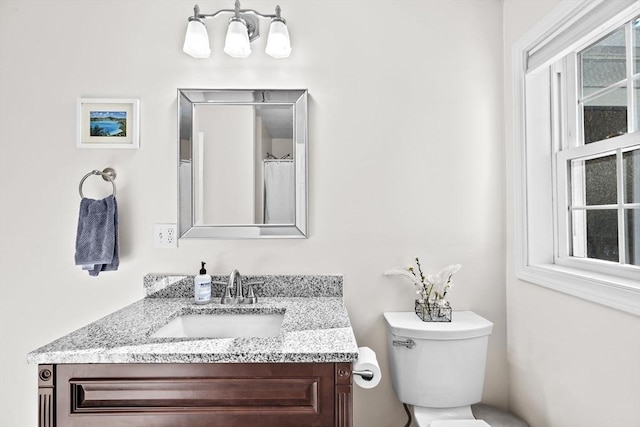 bathroom with vanity and toilet