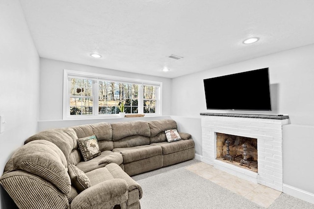 tiled living room with a brick fireplace